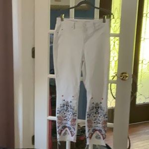 Laurie Felt white button-fly jeans with high-low multi-color bottom. Size 12.
